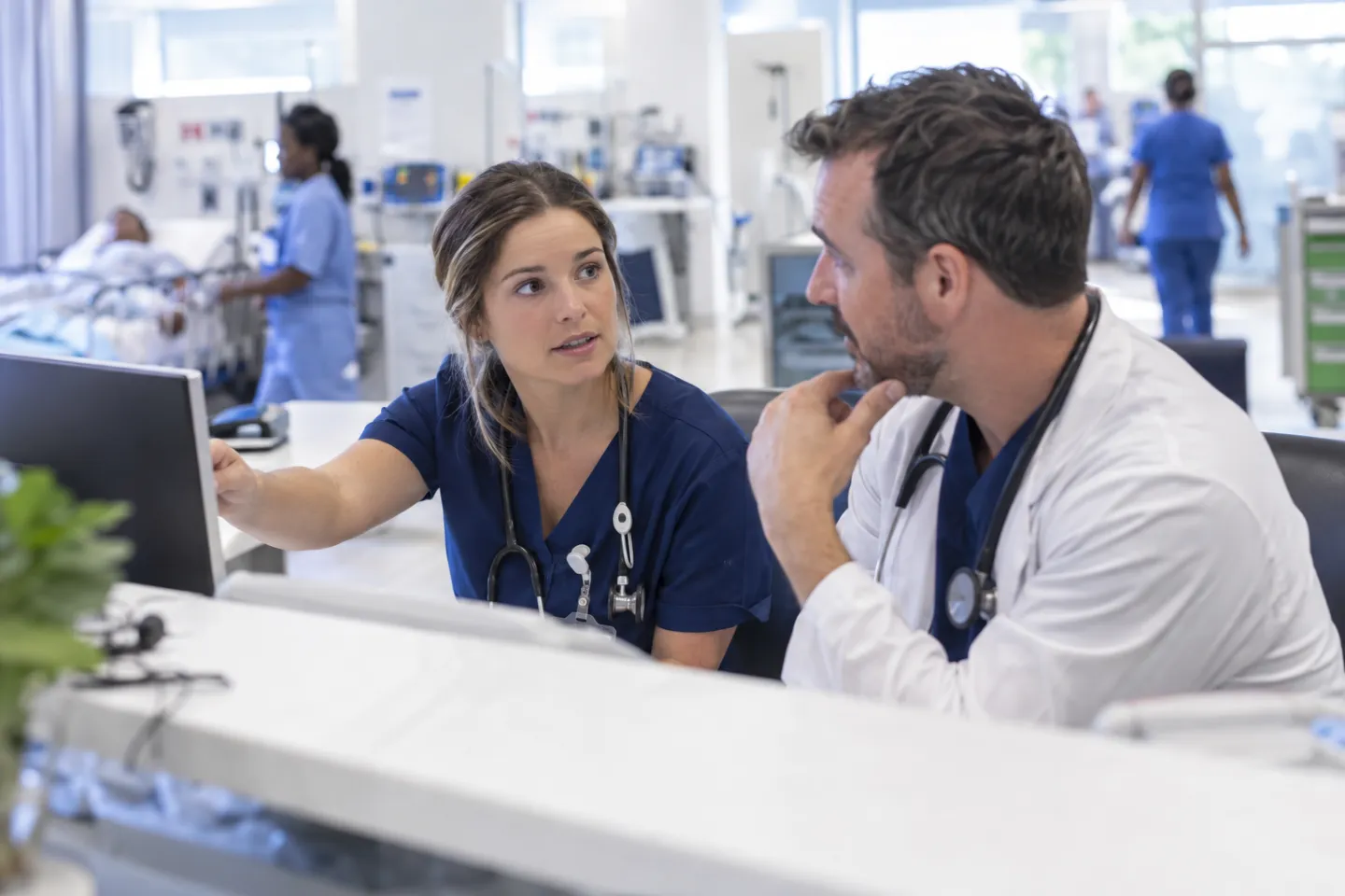 Illustration of a nurse and physician discussing a patient handoff